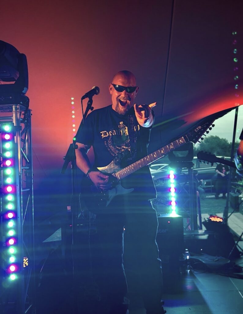 Man performing at a music event based in cheltenham
