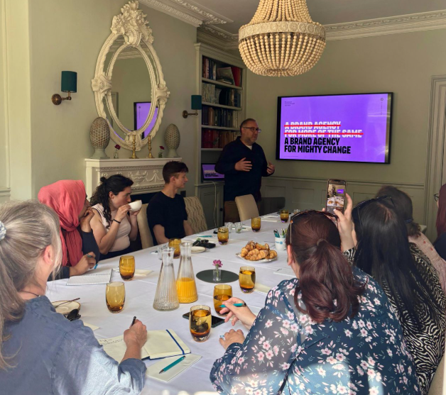 Group watching a presentation on screen